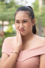 sick woman suffering from toothache, tooth decay, tooth sensitivity, gingivitis, gum inflammation,...