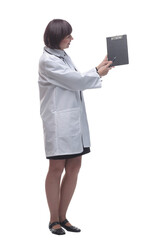 female medic making notes to the clipboard . isolated on a white background.