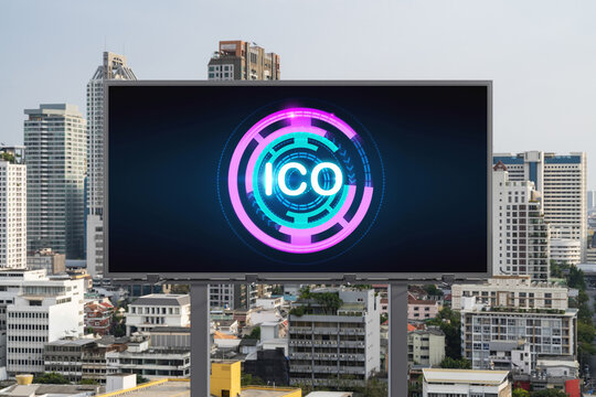 ICO hologram icon on billboard over panorama city view of Bangkok at day time. The hub of blockchain projects in Southeast Asia. The concept of initial coin offering, decentralized finance