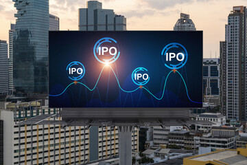 IPO icon hologram on road billboard over sunset panorama city view of Bangkok. The hub of initial public offering in Southeast Asia. The concept of exceeding business opportunities.