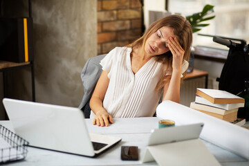  Portrait of tired businesswoman. Businesswoman having headache