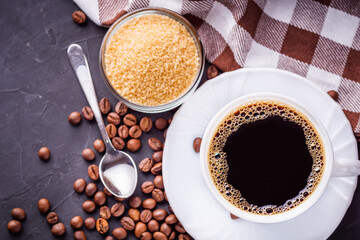 cup of fragrant fresh coffee on a dark stone background
