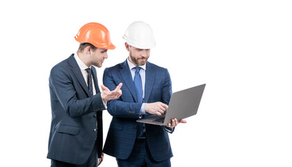 two businesspeople partners in safety helmet working on laptop online copy space, business partners.