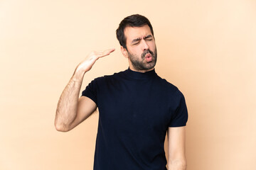 Caucasian handsome man over isolated background with tired and sick expression