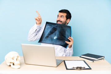 Professional traumatologist in workplace pointing with the index finger a great idea