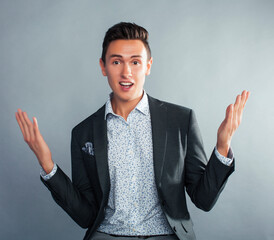 young pretty businessman posing emotional gesturing on white background, lifestyle people concept