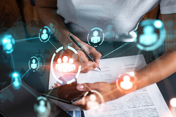 Social network theme hologram and a woman signing contract use phone. Multiexposure.