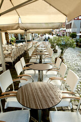 empty tables in a summer cafe in germany