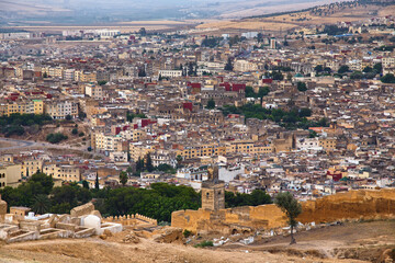 Obraz premium Aerial view of the Fez el Bali medina. Is the oldest walled part of Fez, Morocco. Fes el Bali was founded as the capital of the Idrisid dynasty between 789 and 808 AD