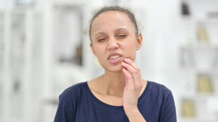 Portrait of Young African Woman having Toothache 