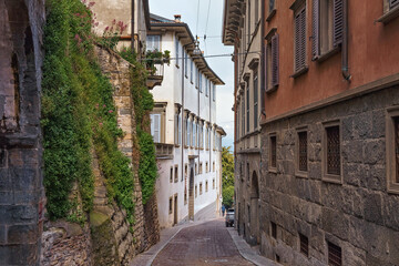 Fototapeta na wymiar View of the old narrow historical streets in Upper Bergamo (Citta Alta). Italy.