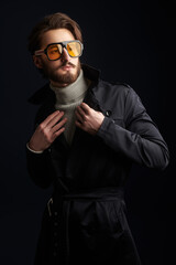 trendy man in in raincoat