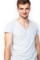 Obraz premium young handsome teenage hipster guy posing emotional, happy smiling against white background isolated, lifestyle people concept