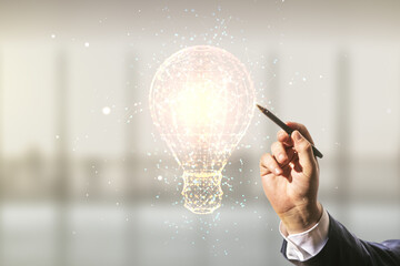 Male hand with pen draws abstract virtual light bulb illustration on blurred office background, future technology concept. Multiexposure