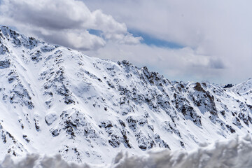 Landscape of Snowy mountain peaks in India. Mountains captured in snow great place for winter sports.