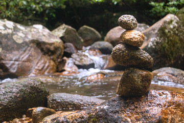 Fototapeta na wymiar Stones balance zen pyramid.Rock on the river background.Life balance,meditation,Healthy,Lifestyle.Photo concept of balance and harmony.