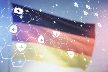 Abstract virtual medical hologram on German flag and sunset sky background, online medical consulting concept. Multiexposure