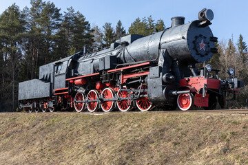 Naklejka premium old steam locomotive on rails