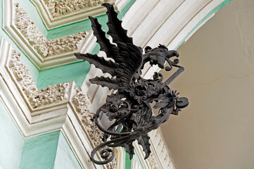 Griffin sculpture side view mounted on a wall of old building in Kyiv Ukraine
