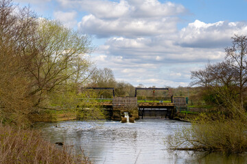 Sluice gate on the Ouse, walking on the Ouse way on a spring afternoon, Sussex, England