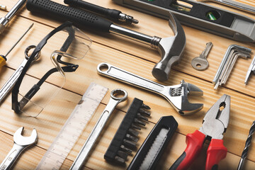 All tools supplies home construction on the wooden table background. Building tool repair...