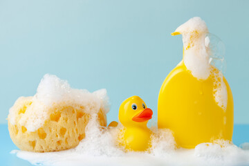 Baby shampoo  on a white  background, rubber yellow ducks, soap foam. Bathroom accessories