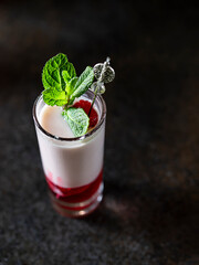 Shot cocktails with raspberry, vanilla liqour, vodka. Fresh summer shots for party.