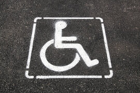Disabled parking only sign on the floor