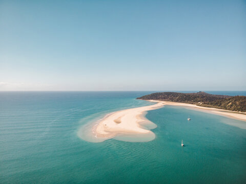 Aerial view of a sand bank with two sailing boats anchored in the water, Double Island Point, Queensland, Australia.