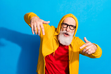 Photo of funky funny cool positive hipster grandfather in glasses dancing wear tracksuit isolated on blue color background