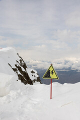 Naklejka na ściany i meble Danger sign on the background of a ski resort