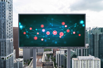 Technology hologram on billboard over panorama city view of Singapore. The largest tech hub in...
