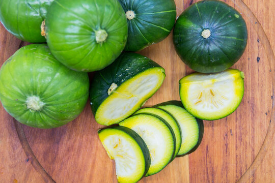 green log zucchini on the wooden board