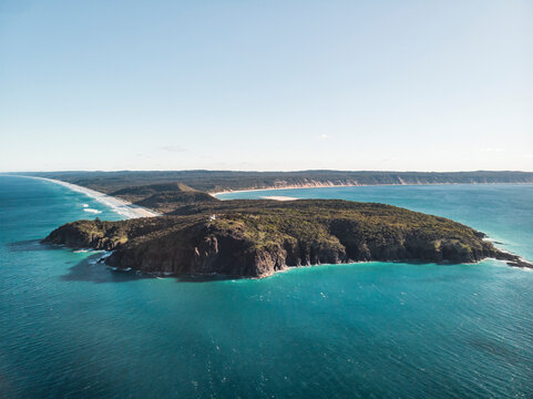 Aerial view of Double Island point with Teewah beach to the left and the coloured sands of Rainbow beach to the right, Queensland, Australia.