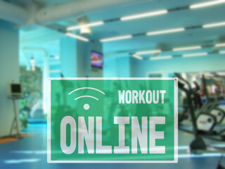 Fototapeta na wymiar sign online workout, due to the closure of the hall during the lockdown. empty Modern gym interior with equipment