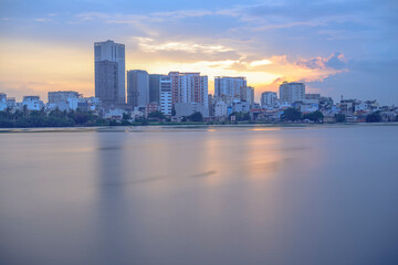 Fototapeta premium Photo done by the author in Ho Chi Minh City, Vietnam. Time: evening on April 27, 2021. When the sunset comes, the author noticed that the color of the sky has a huge change, the photo of the architec