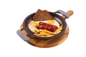 English breakfast in cooking pan with fried eggs, sausages, fries and bread