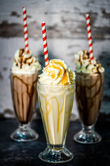 Chocolate and Caramel Whipped Cream Milkshakes Isolated Backdrop Portrait 