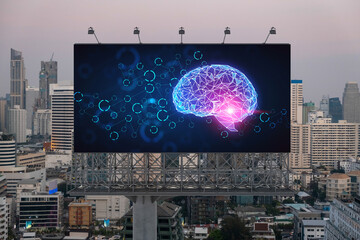 Brain hologram on billboard with Bangkok cityscape background at sunset. Street advertising poster....