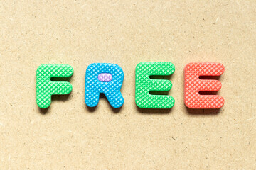 Foam alphabet letter in word free on wood background