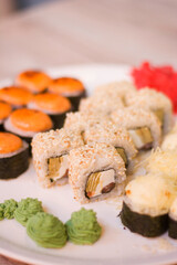 Plate with delicious sushi close up. 