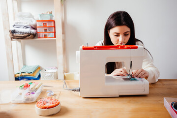 Handmade medical mask on white modern sewing machine