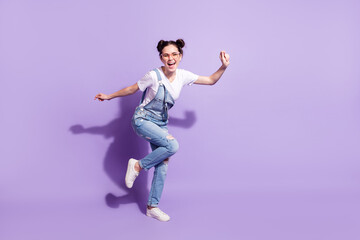 Fototapeta na wymiar Full body photo of excited cheerful person have fun beaming smile isolate don violet color background
