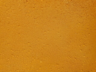 Image of an empty foam board texture painted bright golden yellow Suitable for wall decoration, background picture, or text input.