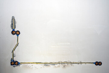 Hidden installation of electrical wires in a old plastering wall. Repair in an old apartment and...