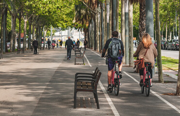 People on streets living and doing normal live in city, biking, sitting