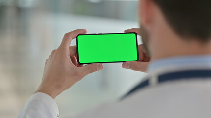 Male Doctor Watching Smartphone with Chroma Screen 