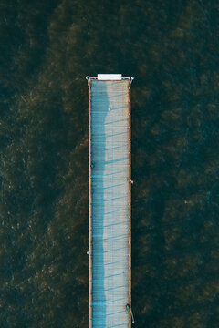 Aerial view of straight line shape pedestrian bridge in Baltic sea near Palanga, Lithuania.