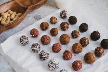 Obraz premium energy balls on a light table, bowl. Homemade healthy sweets