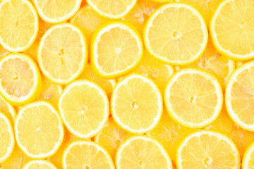 A slices of fresh juicy yellow lemons.  Texture background, pattern